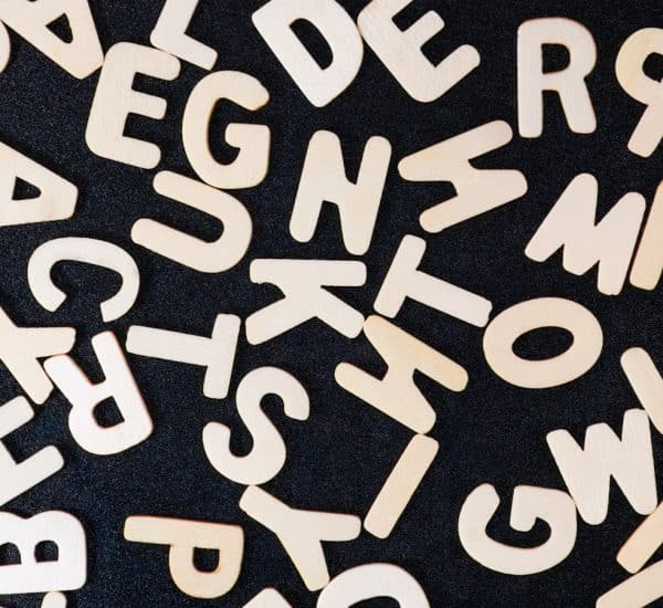 a close up of a black surface with white letters